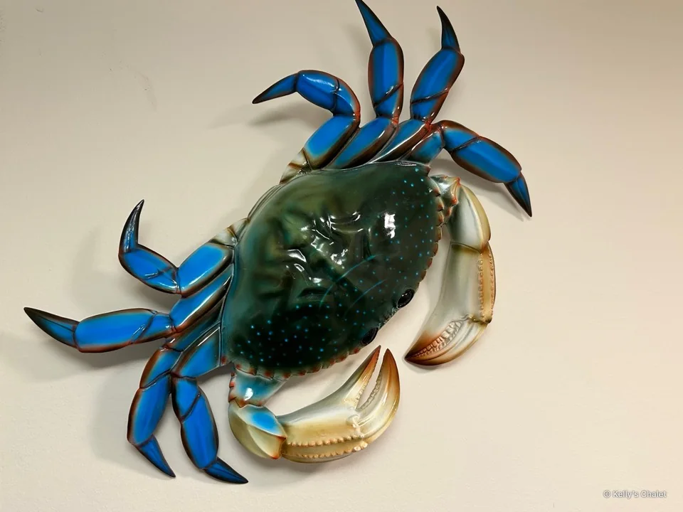 Blue and green crab artwork in the chalet washroom