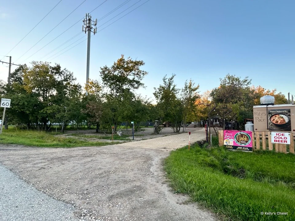 The chalet driveway entrance beside the Gondola sign