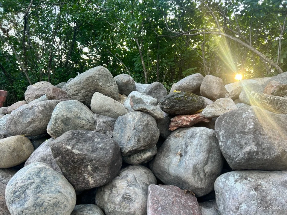 Sunlit stones and greenery at Kelly’s Chalet